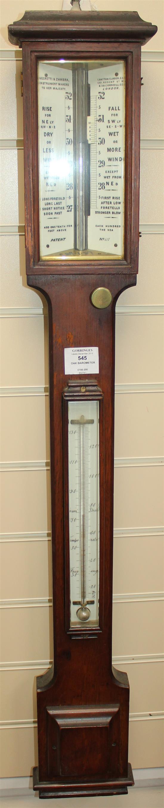 A late Victorian Negretti and Zambra oak stick barometer, 3ft 4in.